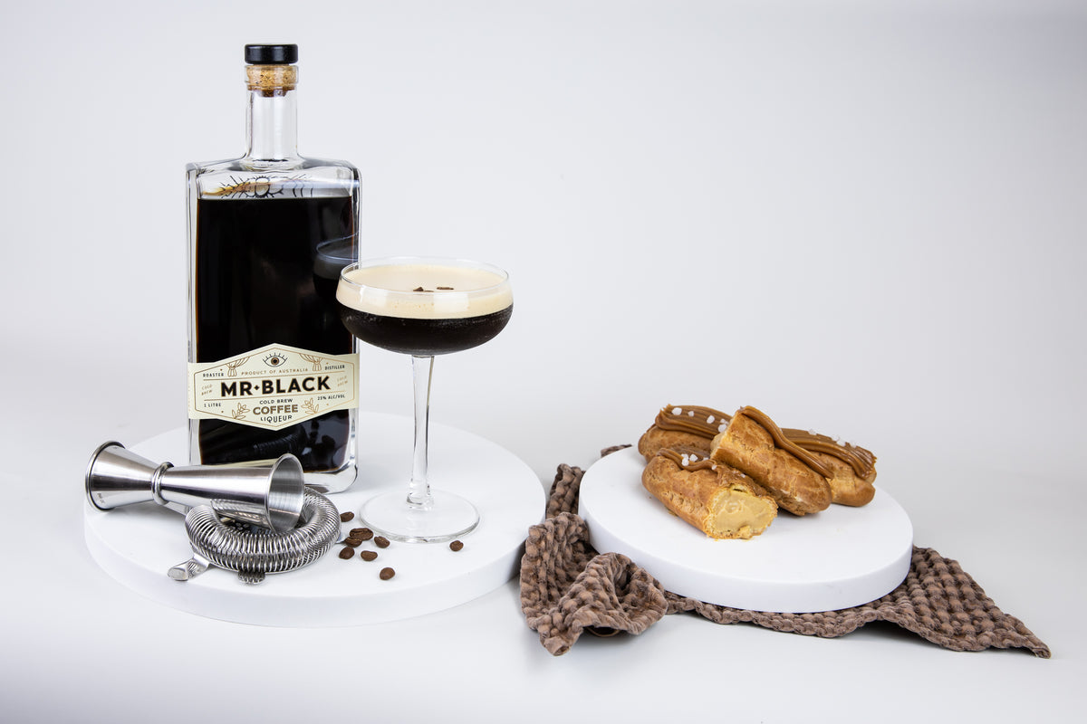 Mr Black Espresso Martini, Caramel Eclairs, Cocktail Shaker on Marble look Platter