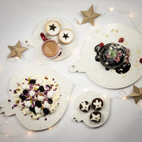 Caesarstone Nougat similar to marble. Serving platters shaped like Christmas decorations. Shown served with Christmas Pudding, fresh raspberries and almond flakes. Christmas Fruit Mince Pies and Pavlova. 