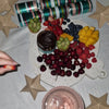 Marble Platter in Caesarstone Nougat. Fruit platter shaped like Christmas teardrop decoration. Shown served with fresh fruit and chocolate dipping sauce.