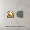 Arial image of Caesarstone rugged concrete arch coaster with a glass of whiskey and large ice cube on a marble surface with text 'Rugged Concrete Arch Coasters 10x2cm'.
