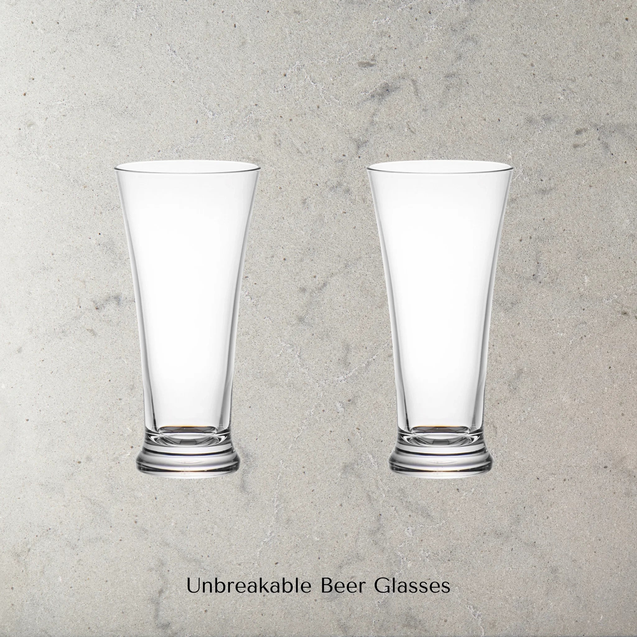Two Dstill unbreakable pilsner beer glasses on a grey marble concrete background with text 'Unbreakable Beer Glasses'.
