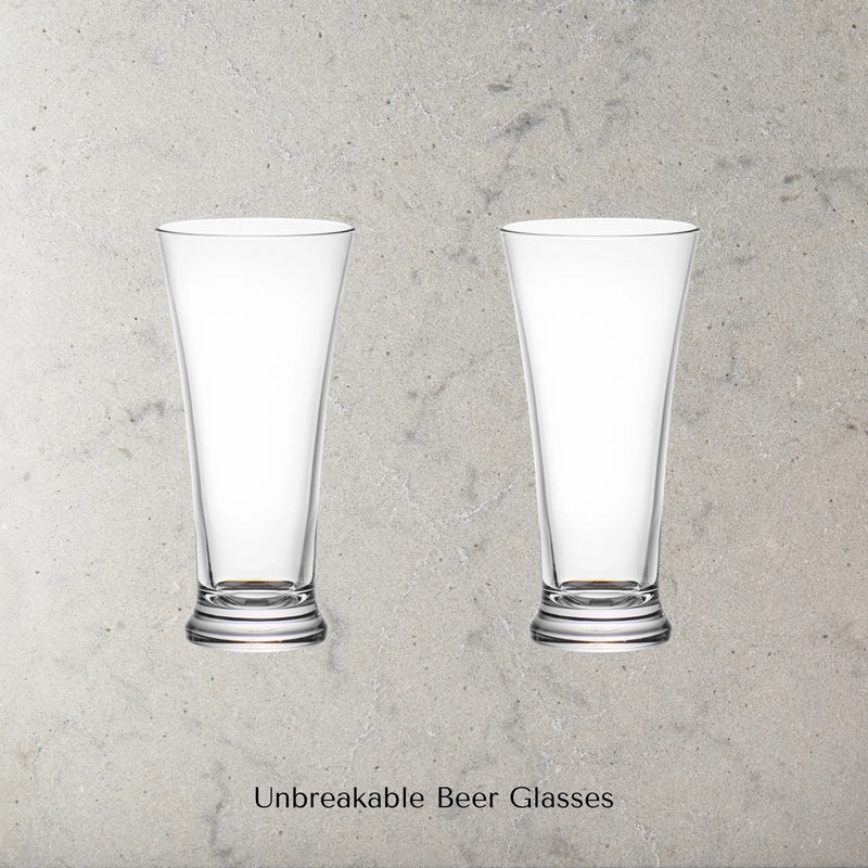 Two Dstill unbreakable pilsner beer glasses on a grey marble concrete background with text 'Unbreakable Beer Glasses'.