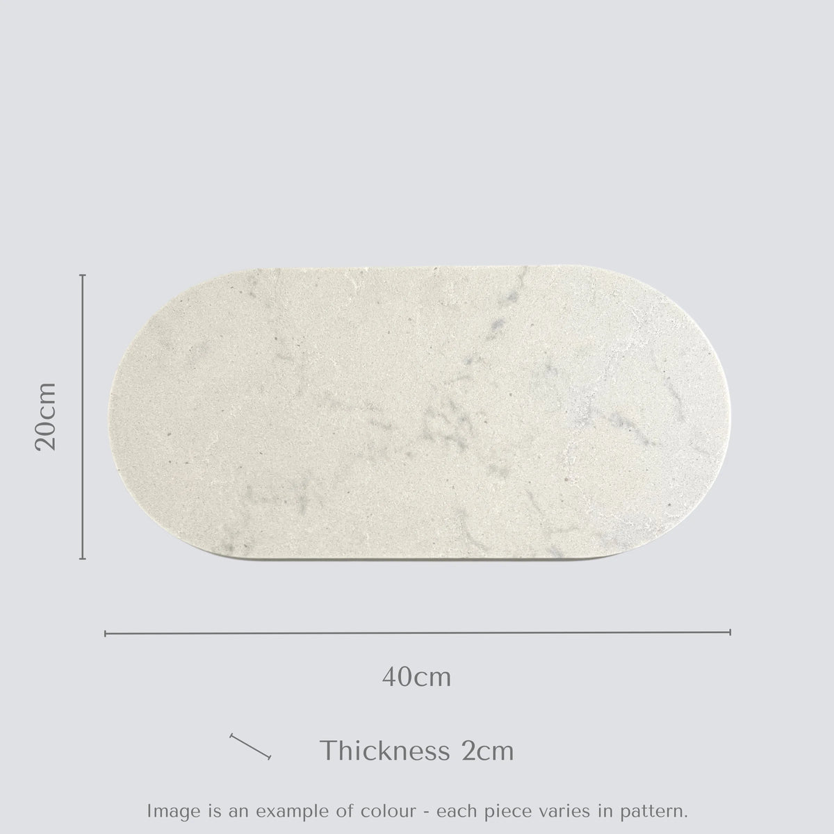Marble-patterned oval stone food platter with dimensions on a light gray background.
Caesarstone Georgian Bluffs created by Aureliia Collection. 