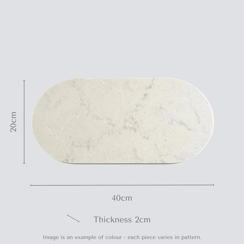 Marble-patterned oval stone food platter with dimensions on a light gray background.
Caesarstone Georgian Bluffs created by Aureliia Collection. 