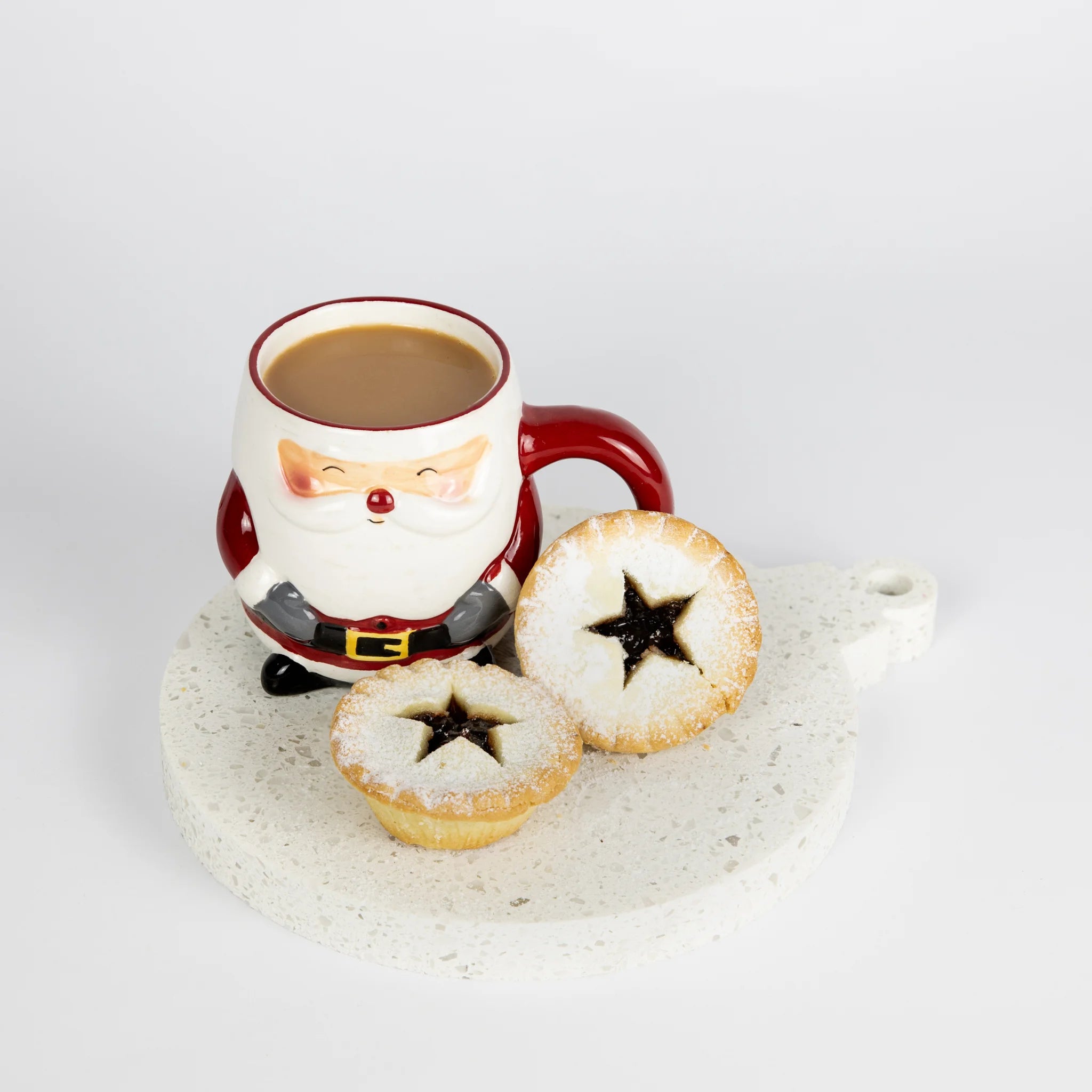 Santa-themed mug with a drink and mince pies on a stone surface, Christmas Decoration shaped large coaster.
